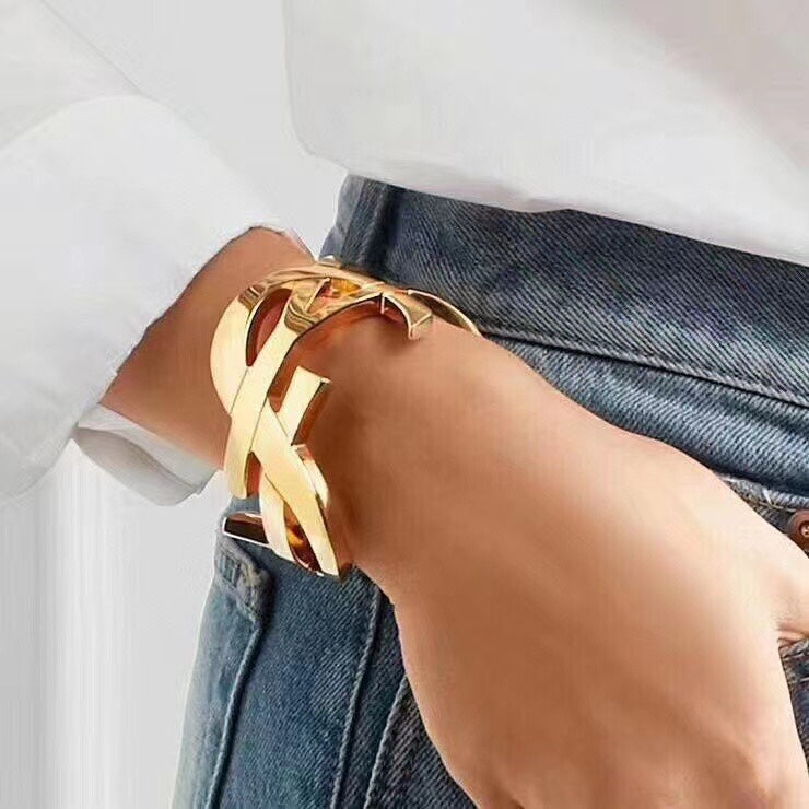 YSL 26S CRISS CROSS OPEN CUFF BRACELET IN GOLD TONE METAL 635064