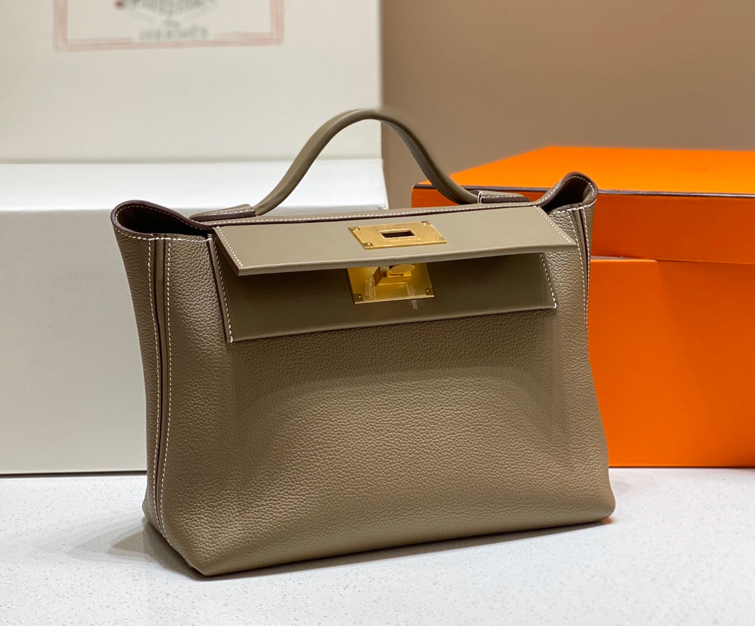 HM 26S 24/24 29CM IN BROWN EVERCOLOR CALFSKIN GOLD KELLY BUCKLE