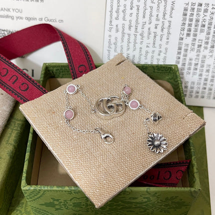GUCCI 26S DOUBLE G LOGO PINK STONE MULTI CHARM BRACELET IN SILVER TONE METAL