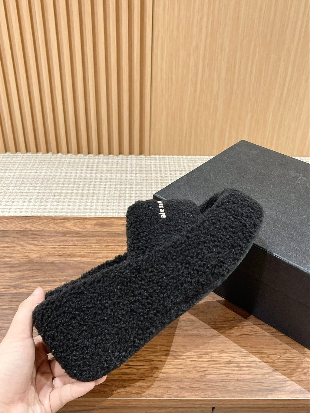 CHUNKY PLATFORM SIPPERS IN BLACK LAMBSWOOL