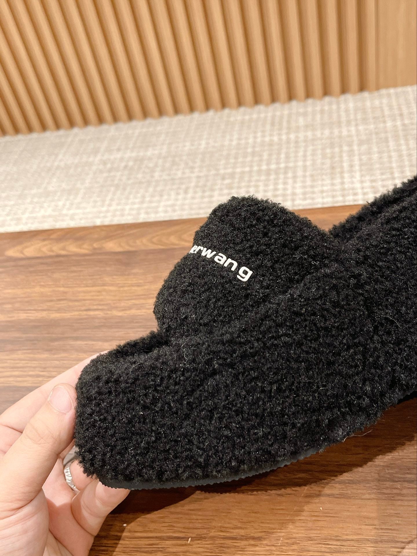 CHUNKY PLATFORM SIPPERS IN BLACK LAMBSWOOL