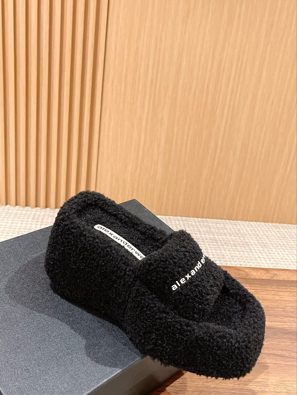 CHUNKY PLATFORM SIPPERS IN BLACK LAMBSWOOL