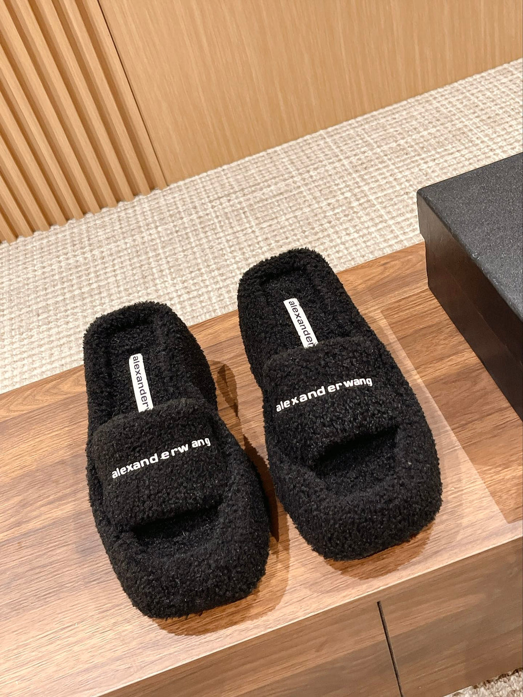 CHUNKY PLATFORM SIPPERS IN BLACK LAMBSWOOL