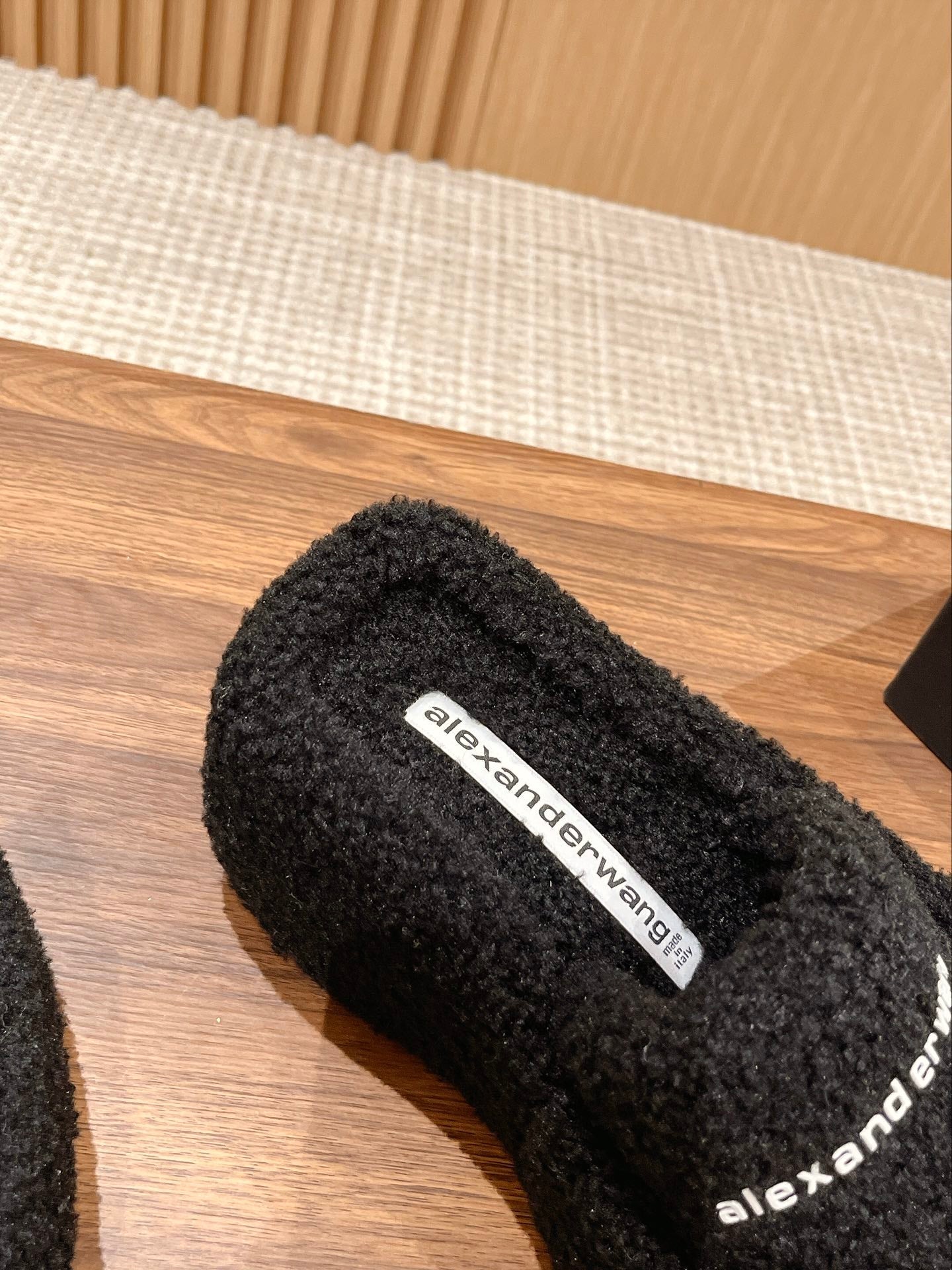 CHUNKY PLATFORM SIPPERS IN BLACK LAMBSWOOL