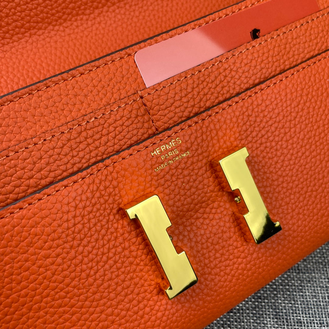 HM CLUTCH CONSTANCE 22 ORANGE CALFSKIN GOLD HARDWARE