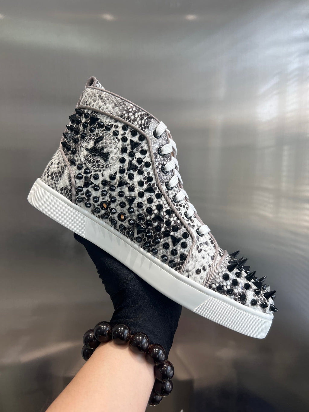 SPIKE STUDDED HIGH-TOP SNEAKERS IN WHITE MIX BLACK CALFSKIN