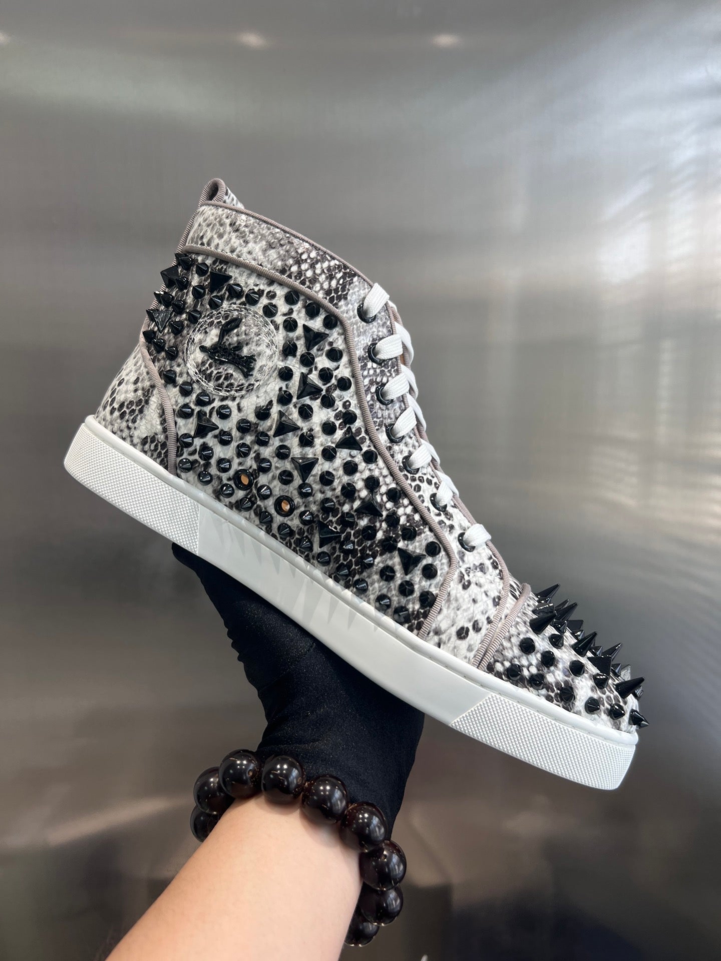 SPIKE STUDDED HIGH-TOP SNEAKERS IN WHITE MIX BLACK CALFSKIN