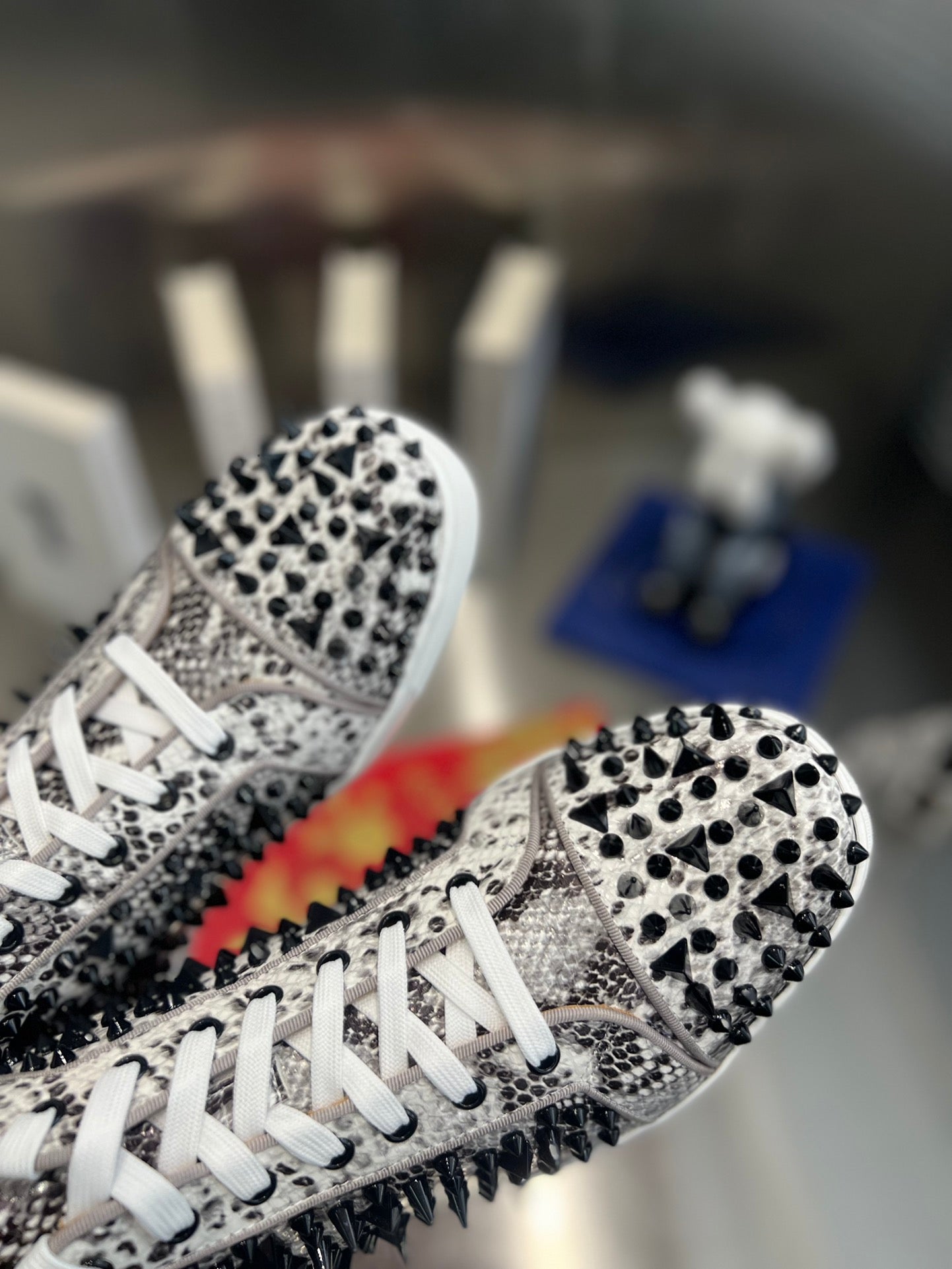 SPIKE STUDDED HIGH-TOP SNEAKERS IN WHITE MIX BLACK CALFSKIN