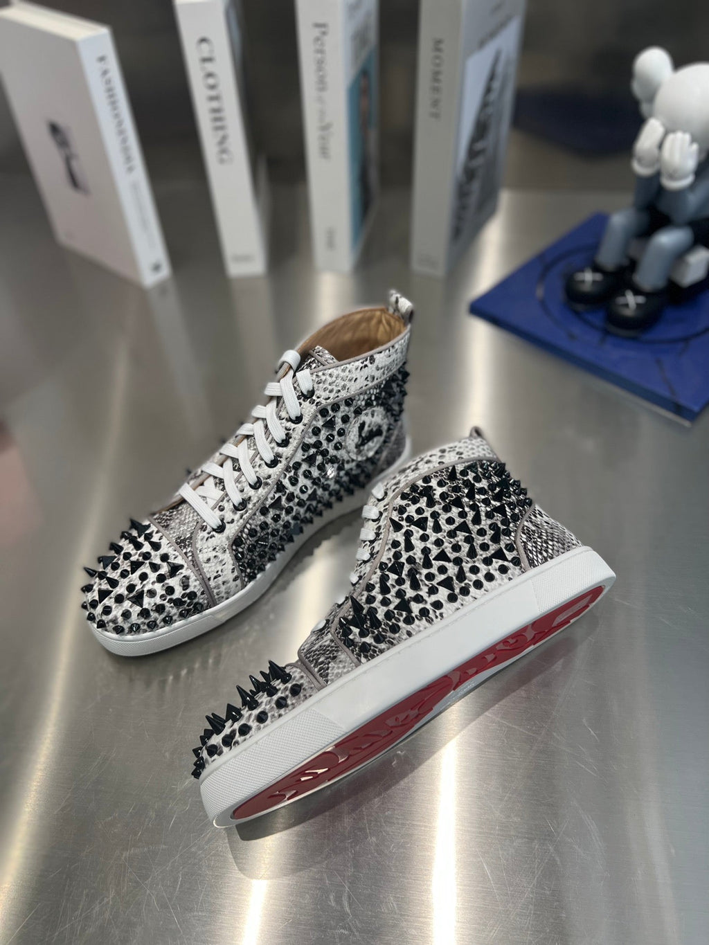 SPIKE STUDDED HIGH-TOP SNEAKERS IN WHITE MIX BLACK CALFSKIN