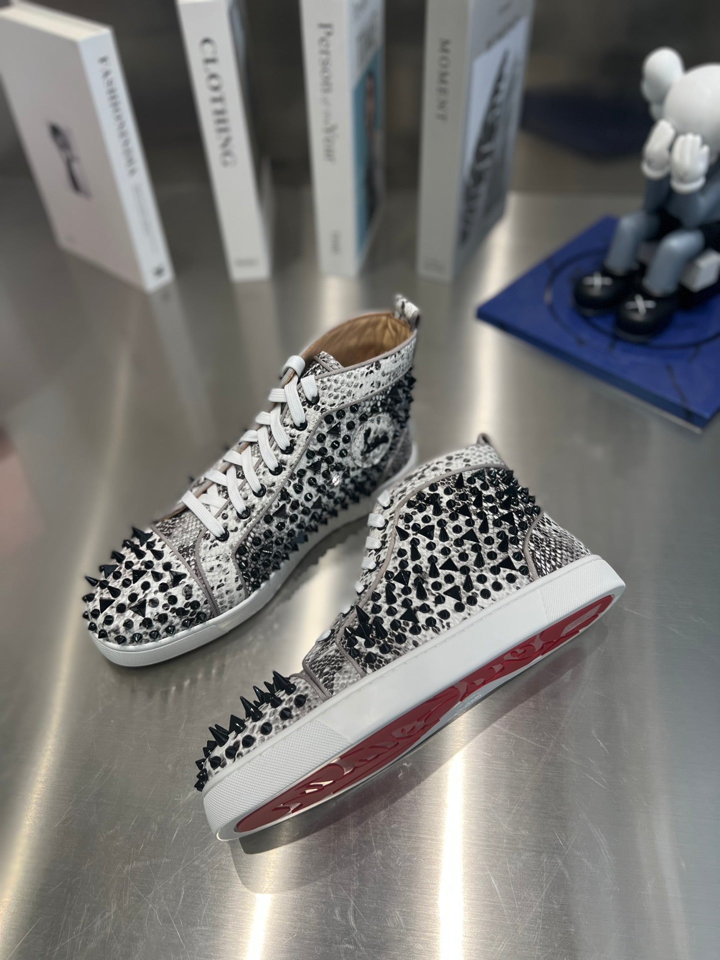 SPIKE STUDDED HIGH-TOP SNEAKERS IN WHITE MIX BLACK CALFSKIN