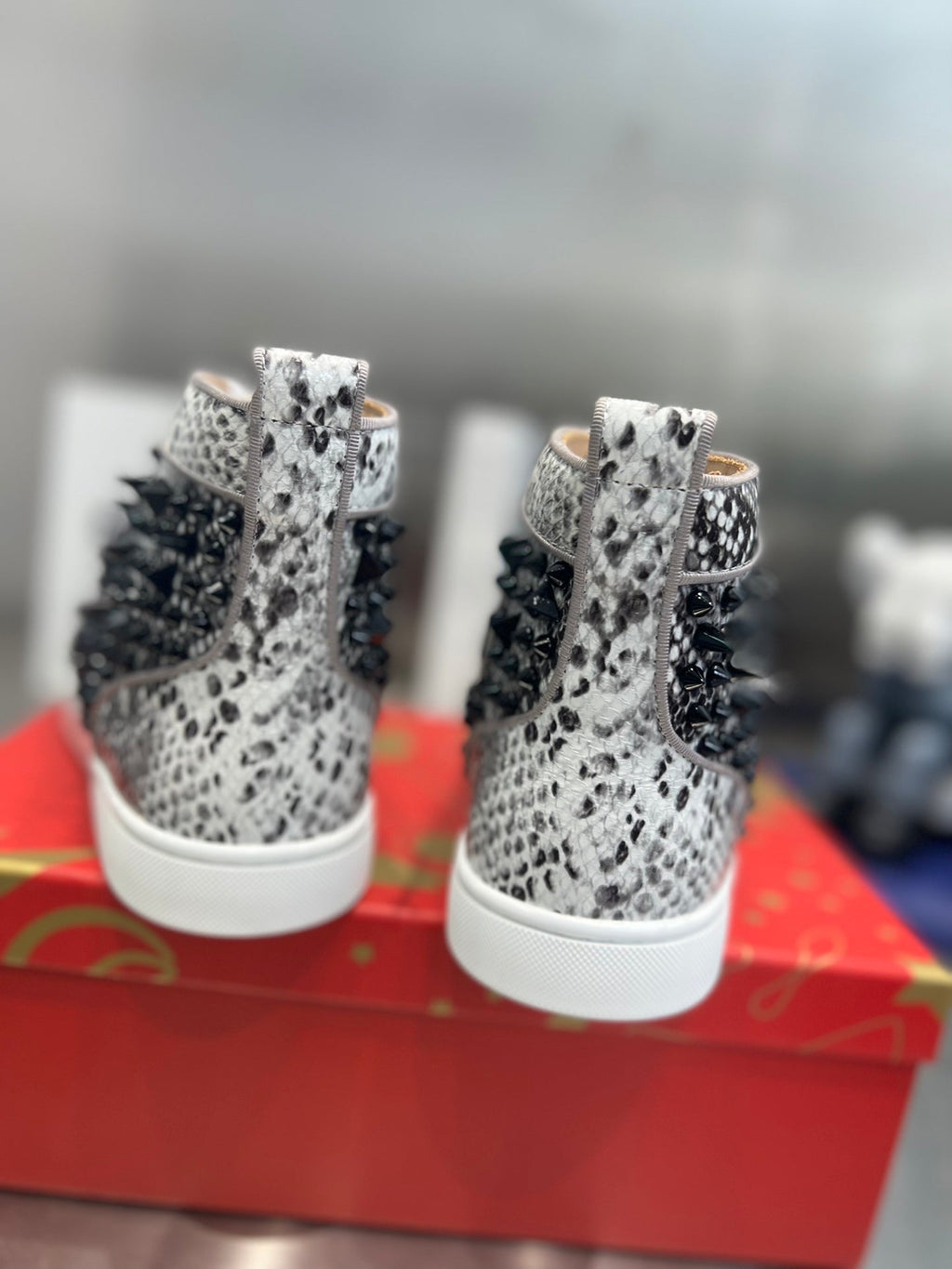 SPIKE STUDDED HIGH-TOP SNEAKERS IN WHITE MIX BLACK CALFSKIN