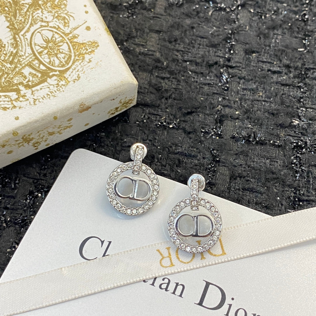 CD 26S CRYSTAL CIRCLE LOGO DROP EARRINGS IN SILVER TONE METAL 644469