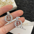 CD 26S CRYSTAL CIRCLE LOGO DROP EARRINGS IN SILVER TONE METAL 644469