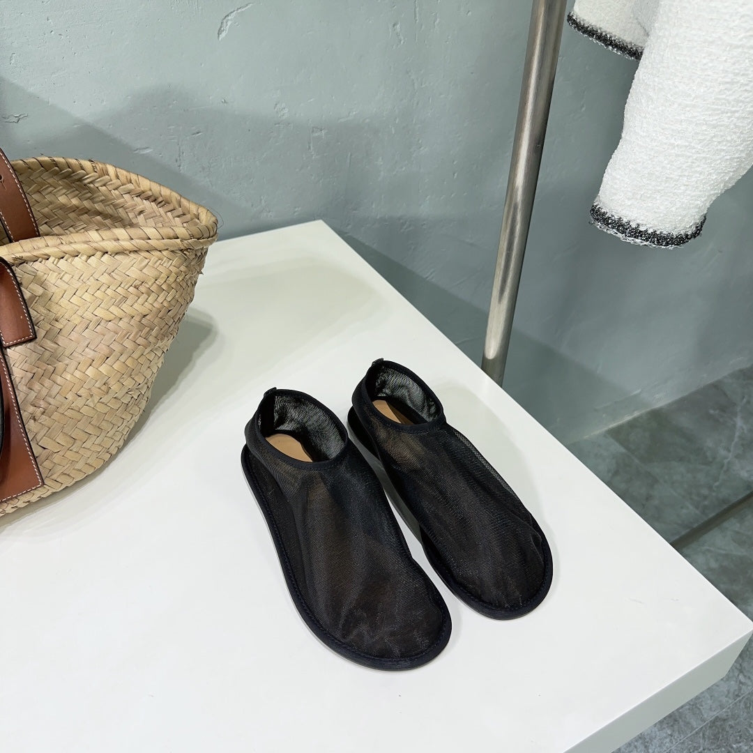 THE ROW 26S SOCK FLATS IN BLACK MESH