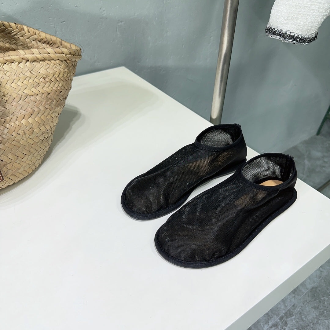 THE ROW 26S SOCK FLATS IN BLACK MESH