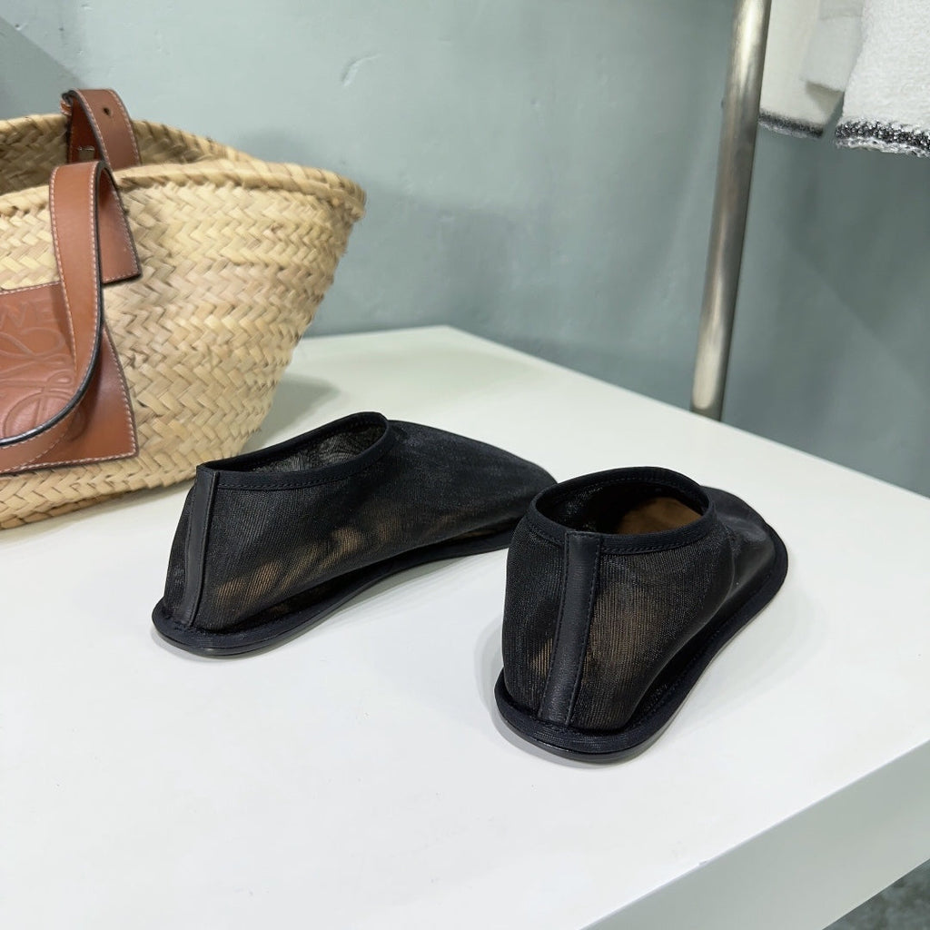 THE ROW 26S SOCK FLATS IN BLACK MESH