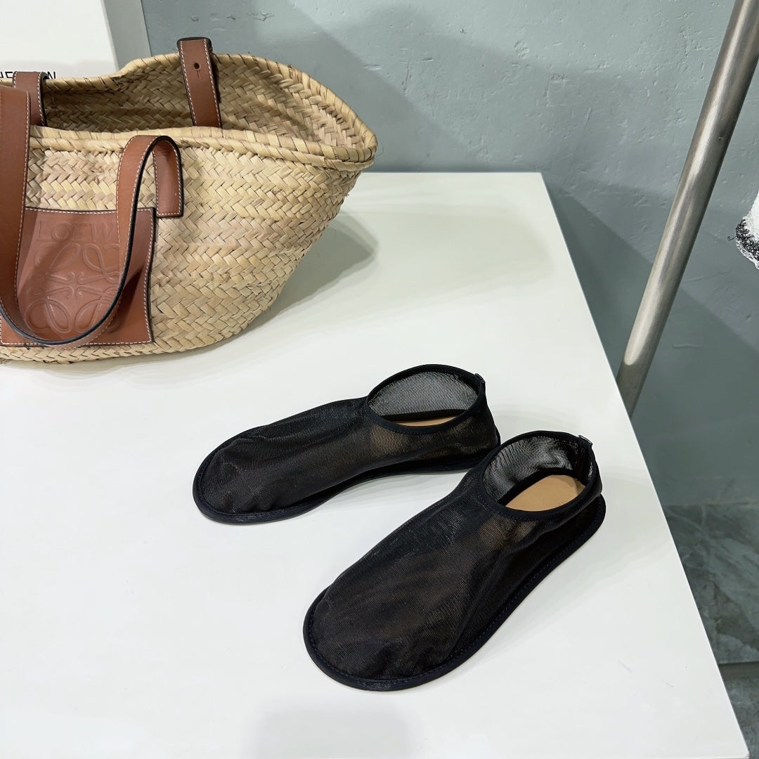 THE ROW 26S SOCK FLATS IN BLACK MESH
