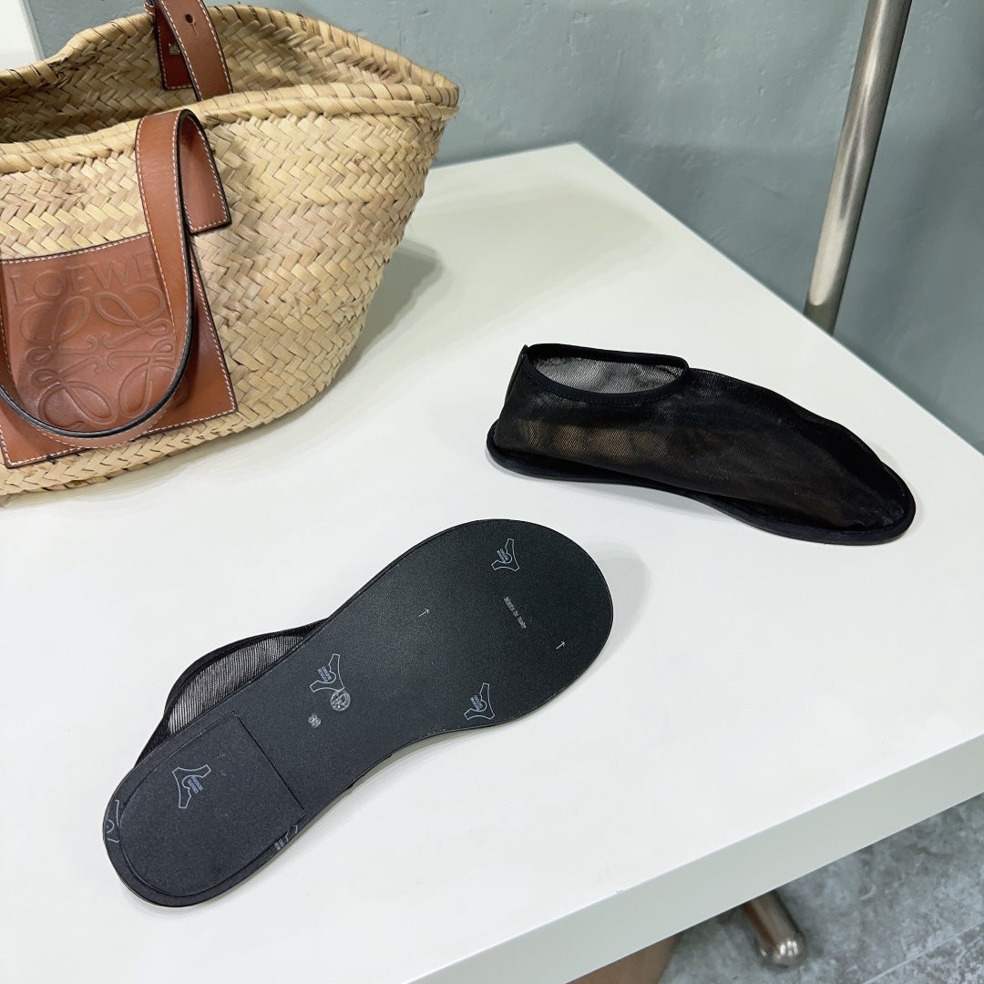 THE ROW 26S SOCK FLATS IN BLACK MESH