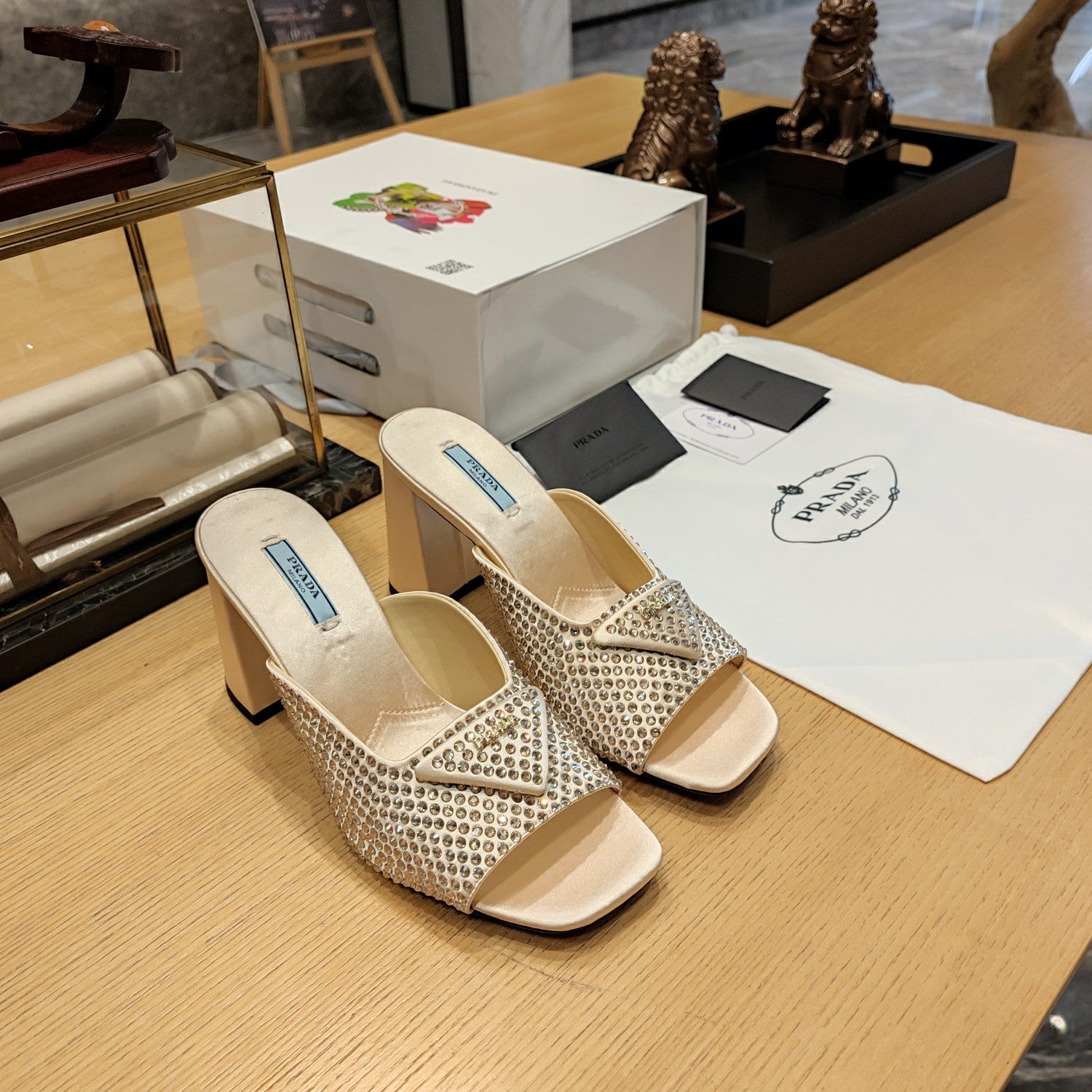 PRADA 26S OPEN TOE CRYSTAL EMBELLISHED MULES 100MM IN BEIGE SATIN