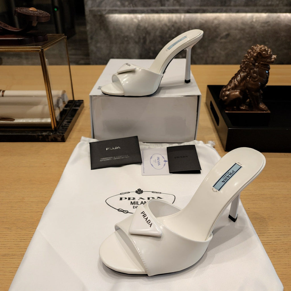 PRADA 26S OPEN TOE MULES 100MM IN IVORY WHITE PATENT CALFSKIN WITH LOGO