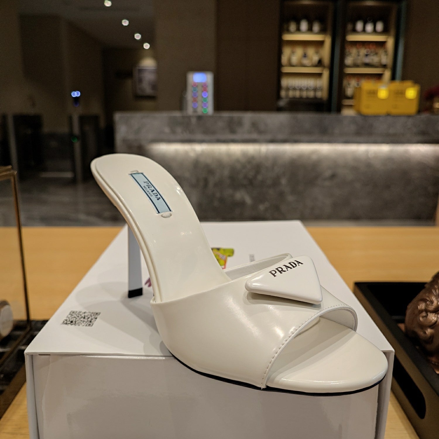 PRADA 26S OPEN TOE MULES 100MM IN IVORY WHITE PATENT CALFSKIN WITH LOGO