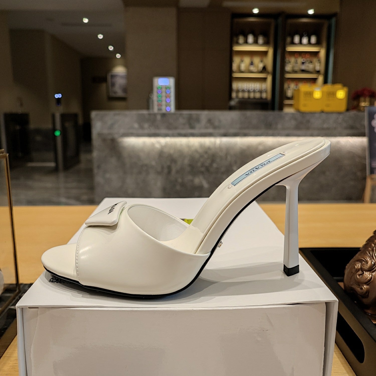 PRADA 26S OPEN TOE MULES 100MM IN IVORY WHITE PATENT CALFSKIN WITH LOGO