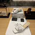 PRADA 26S OPEN TOE MULES 45MM IN IVORY WHITE PATENT CALFSKIN WITH ROSETTE