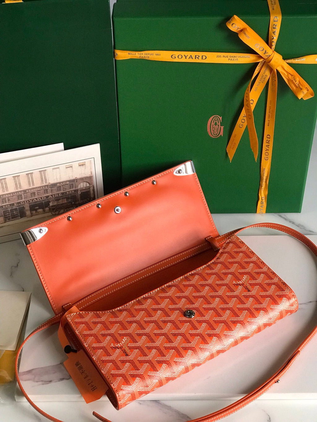 MONTE-CARLO PM CLUTCH 25 IN ORANGE GOYARDINE CANVAS