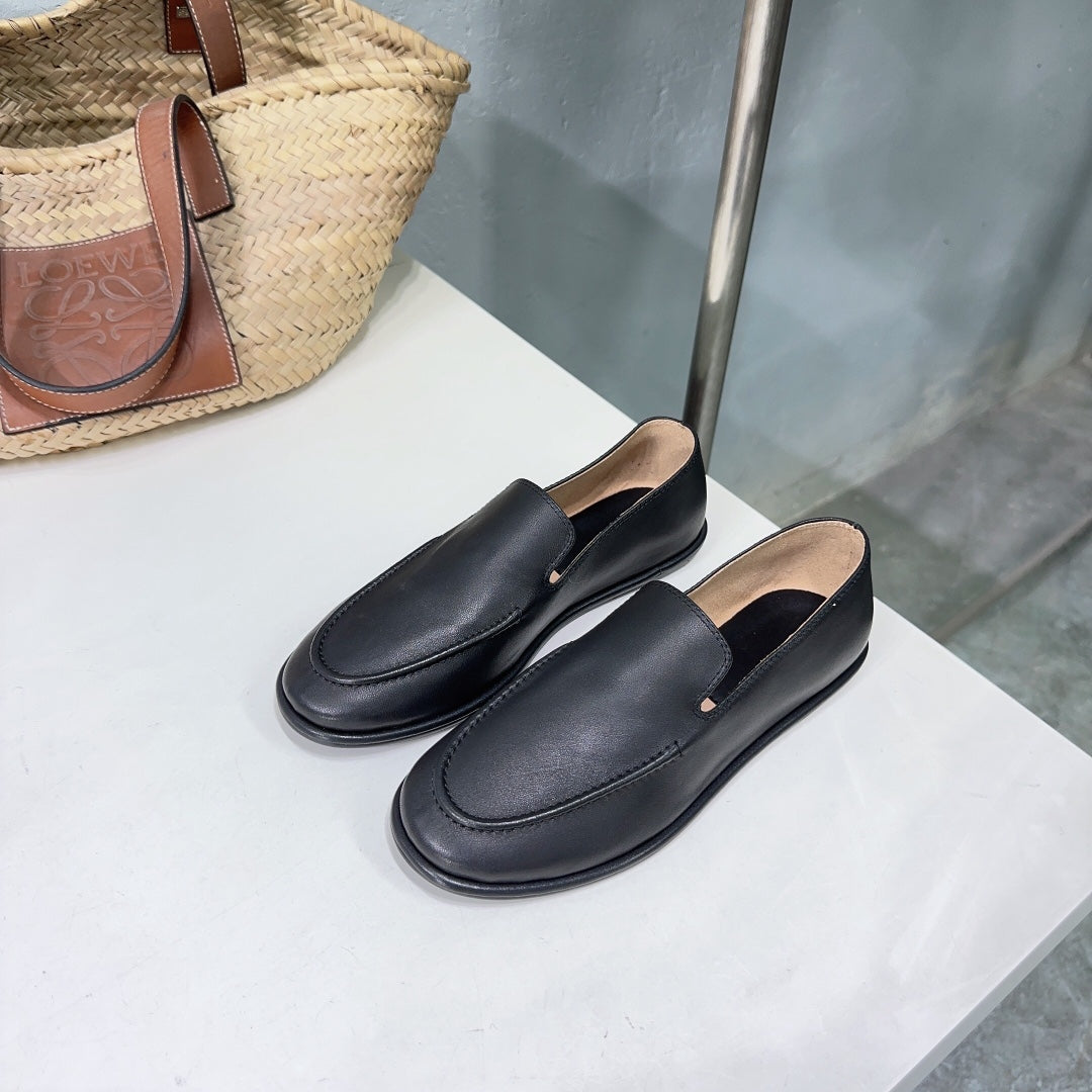 THE ROW 26S CLASSIC LOAFERS IN BLACK CALFSKIN