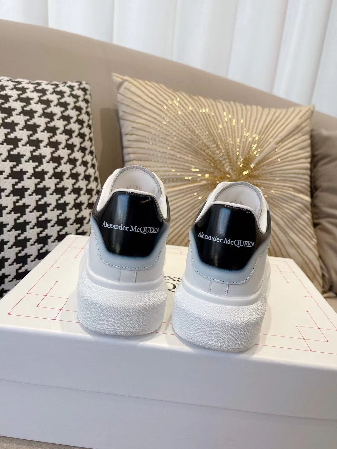 OVERSIZED SNEAKER IN WHITE CALFSKIN WITH GLOSSY BLACK AND WHITE HEEL TAB