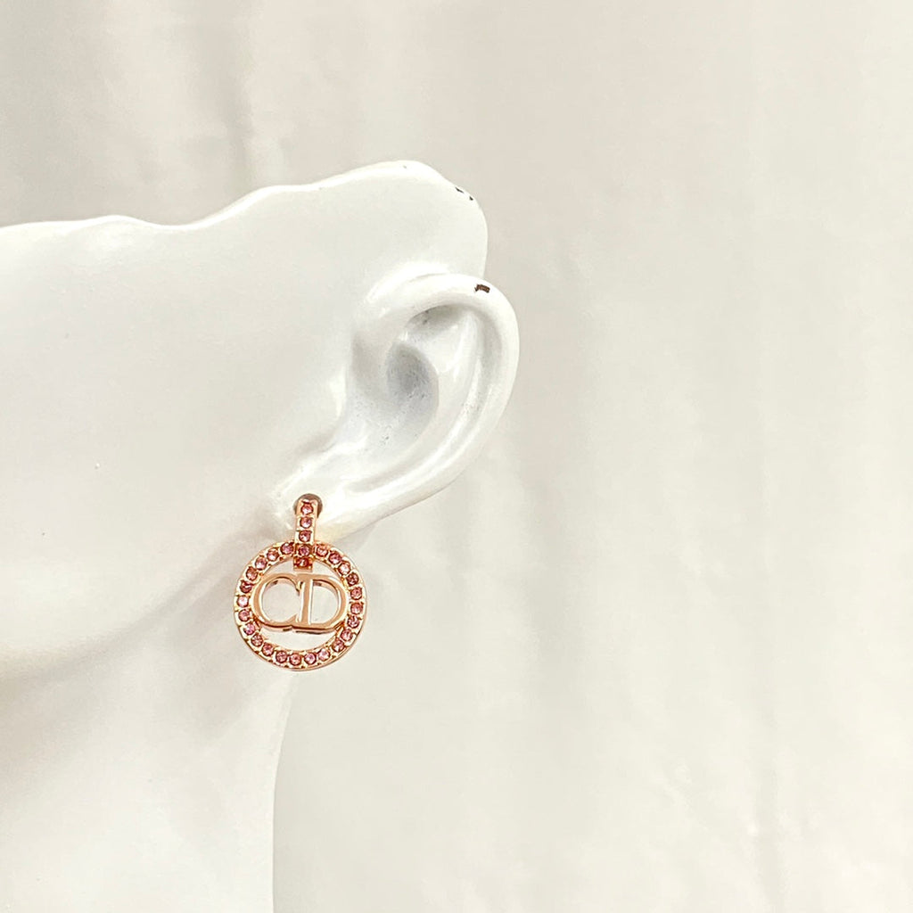 CD 26S CRYSTAL CIRCLE LOGO DROP EARRINGS IN ROSE GOLD TONE METAL 644468