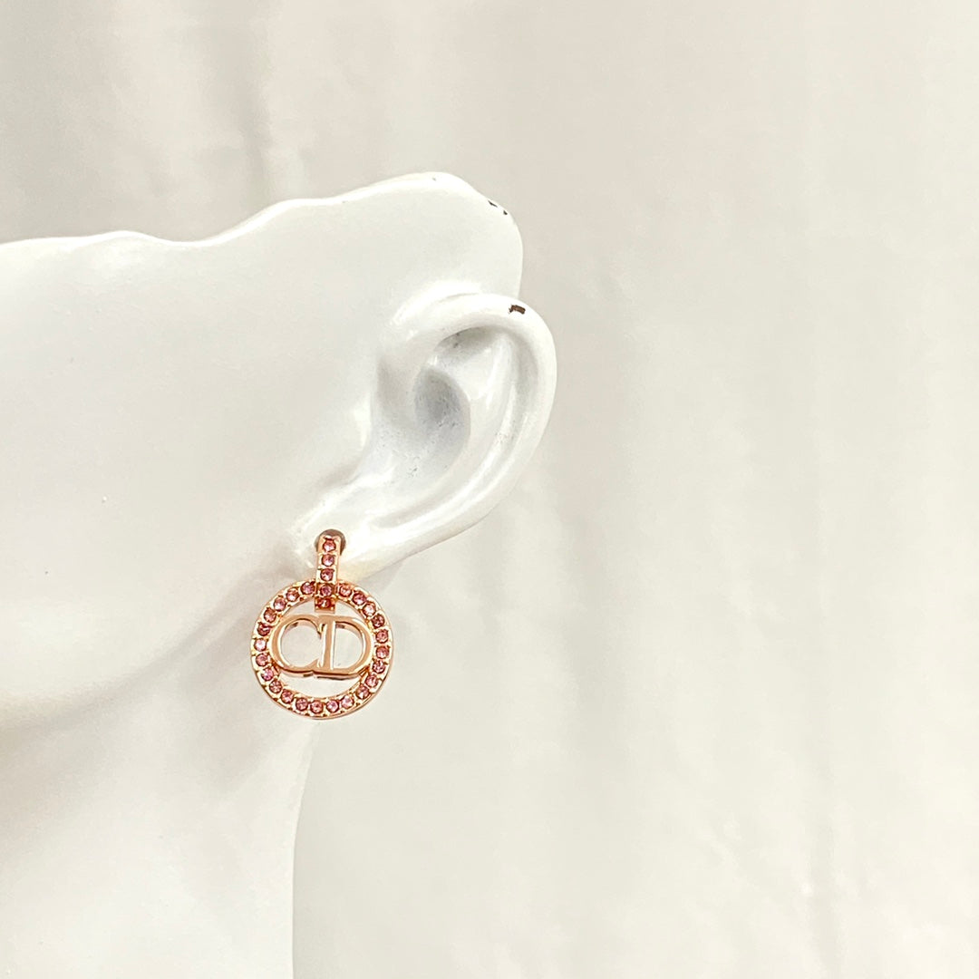 CD 26S CRYSTAL CIRCLE LOGO DROP EARRINGS IN ROSE GOLD TONE METAL 644468