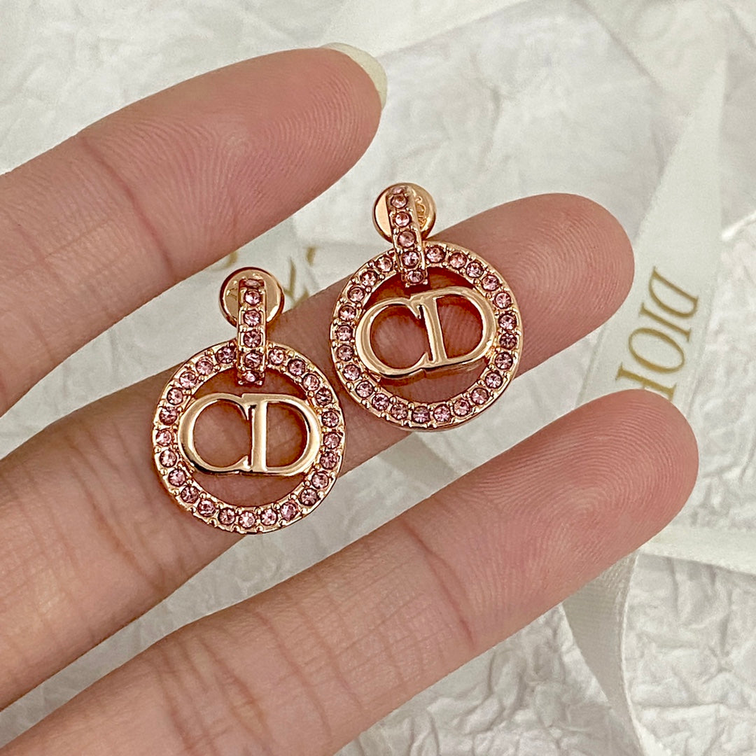 CD 26S CRYSTAL CIRCLE LOGO DROP EARRINGS IN ROSE GOLD TONE METAL 644468