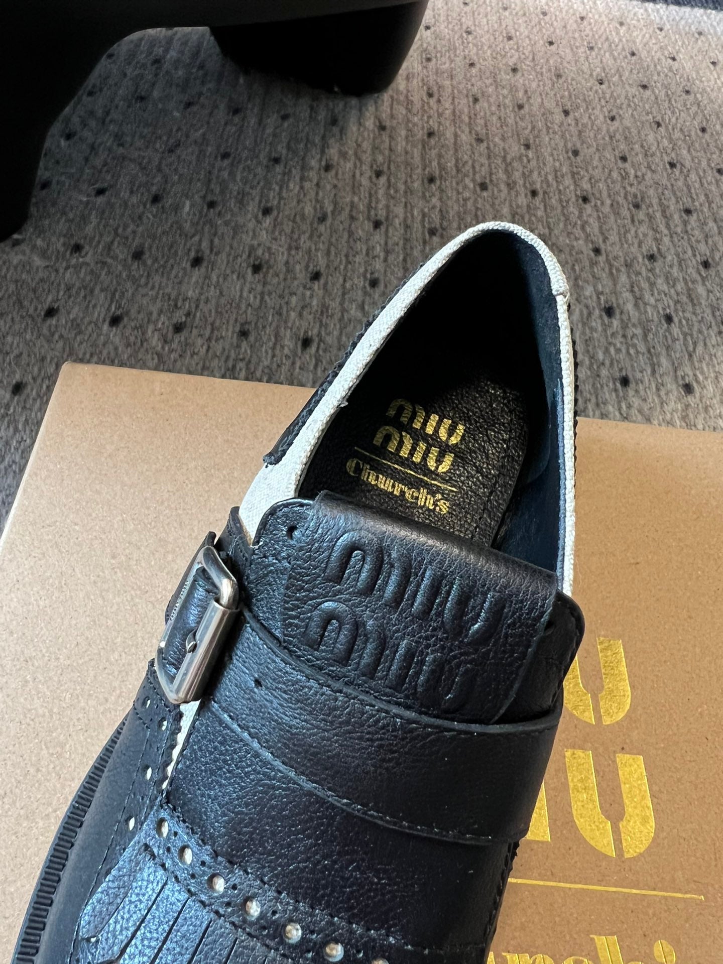 MIUMIU 26S FRINGE BUCKLE LOAFERS IN BLACK CALFSKIN