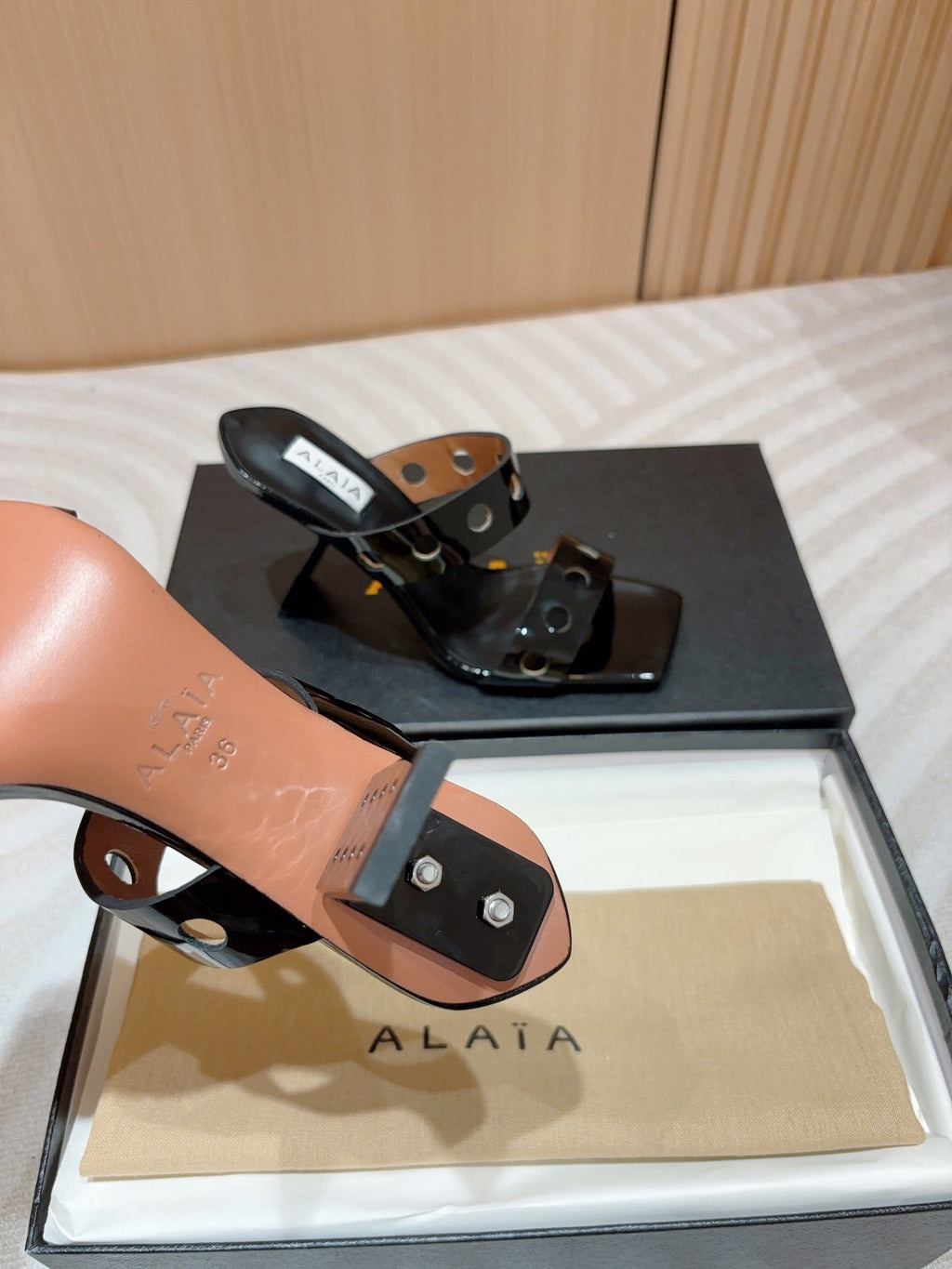 ALAIA TWO-STRAPS HIGH HEEL SANDALS IN BLACK PATENT LAMBSKIN