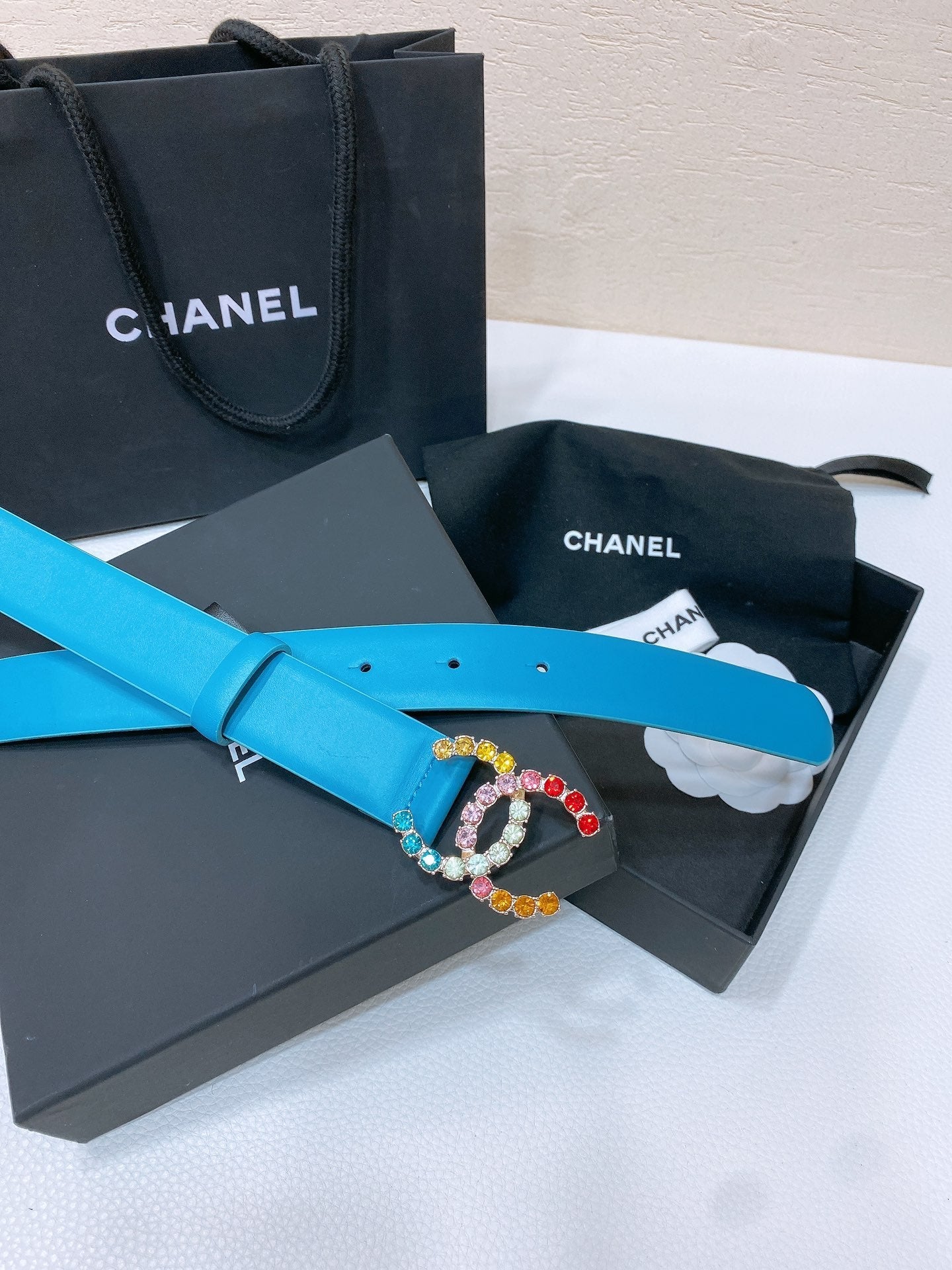 CC BELT 30 MM IN SKY BLUE CALFSKIN WITH COLORFUL RHINSTONES METAL LOGO