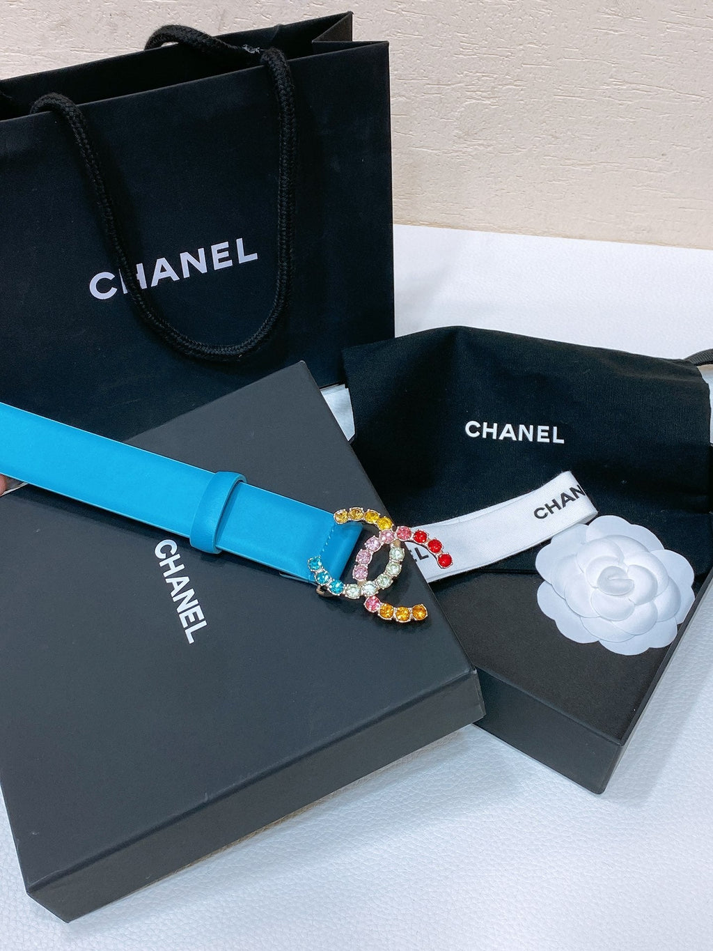 CC BELT 30 MM IN SKY BLUE CALFSKIN WITH COLORFUL RHINSTONES METAL LOGO