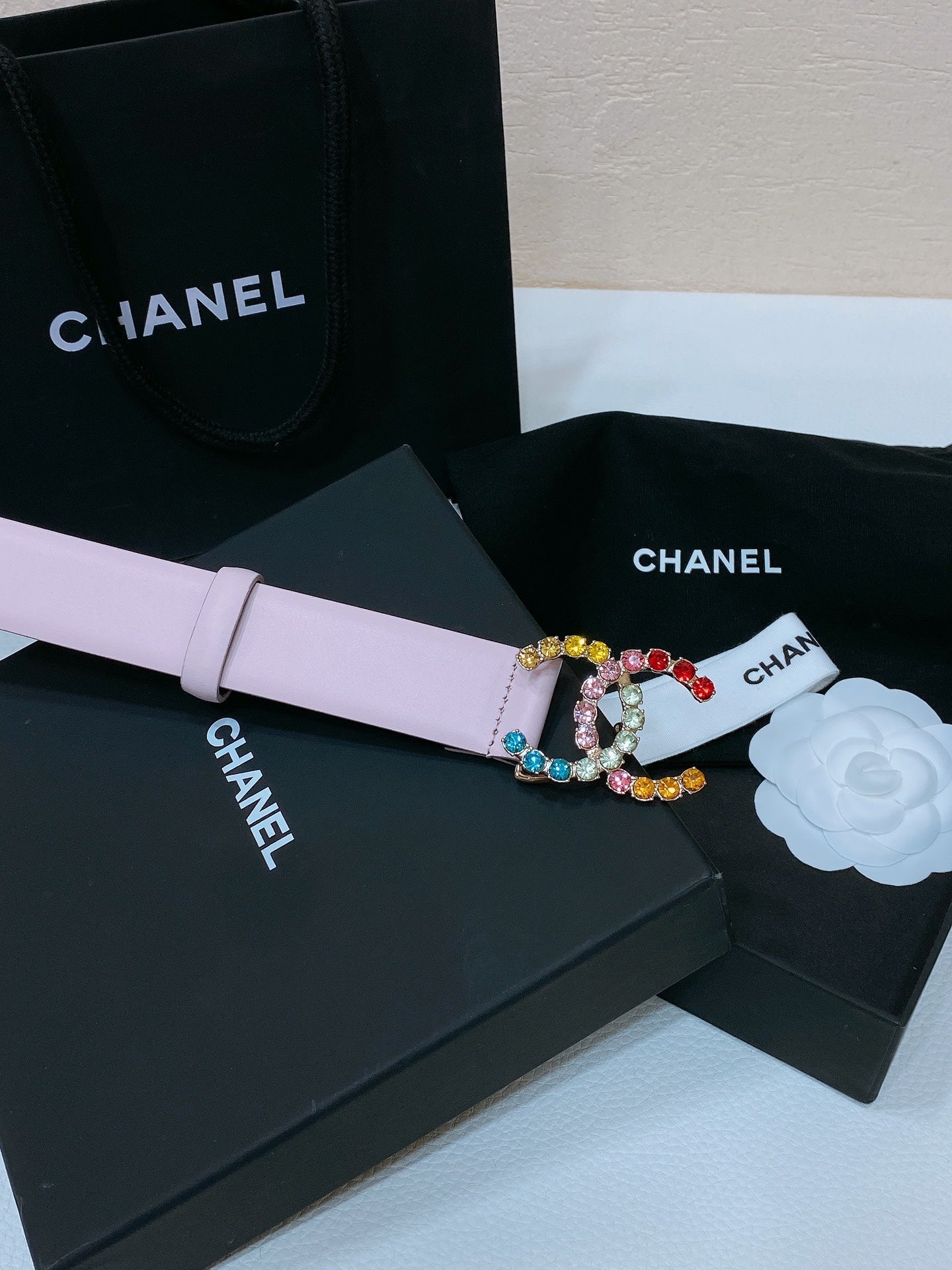CC BELT 30 MM IN PASTEL PINK CALFSKIN WITH COLORFUL RHINSTONES METAL LOGO