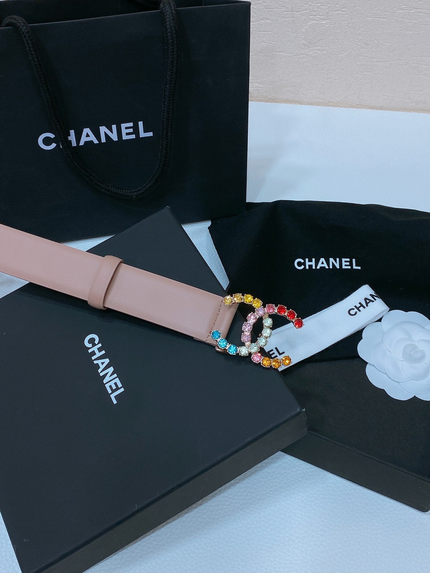 CC BELT 30 MM IN PEACHY PINK CALFSKIN WITH COLORFUL RHINSTONES METAL LOGO