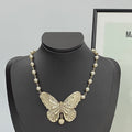 CD 26S PEARL STRAND BUTTERFLY PENDANT NECKLACE IN GOLD METAL 633112