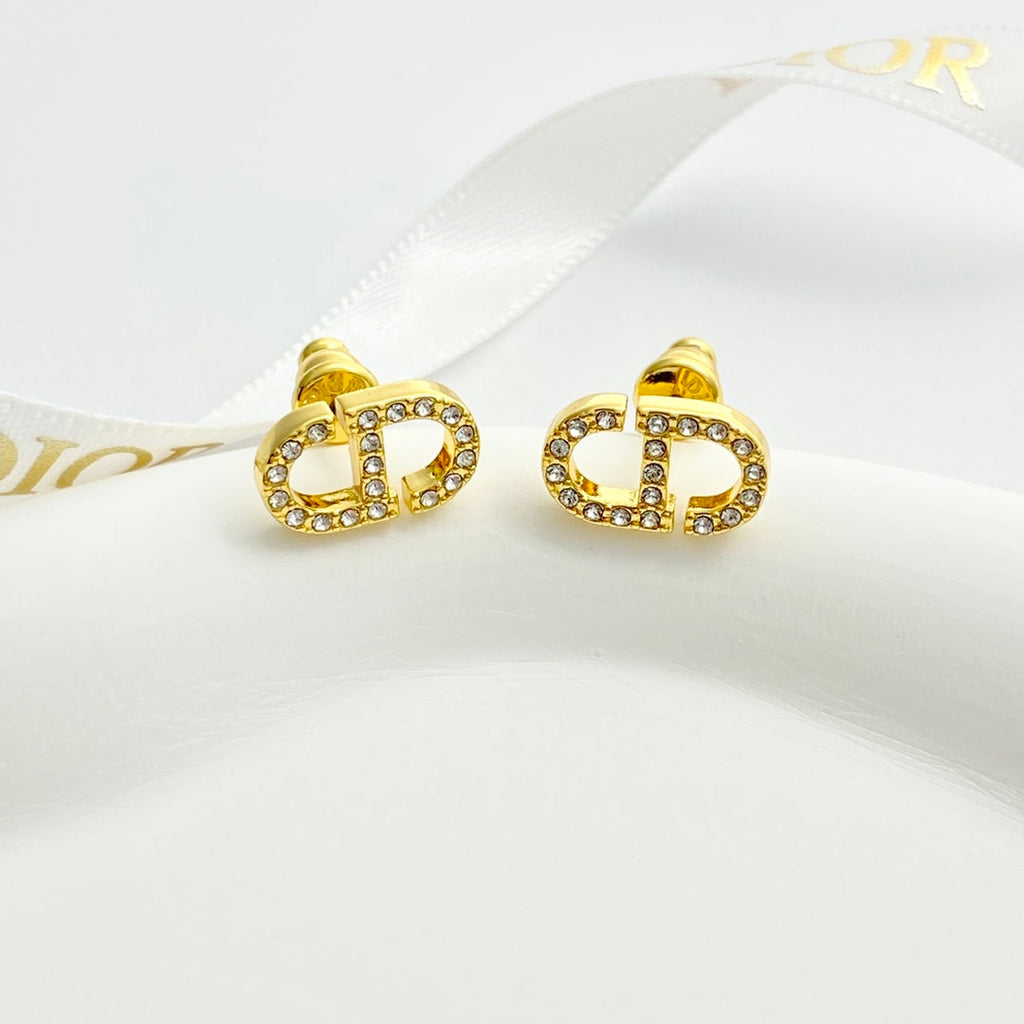 CD 26S CRYSTAL LOGO STUD EARRINGS IN GOLD METAL 633106