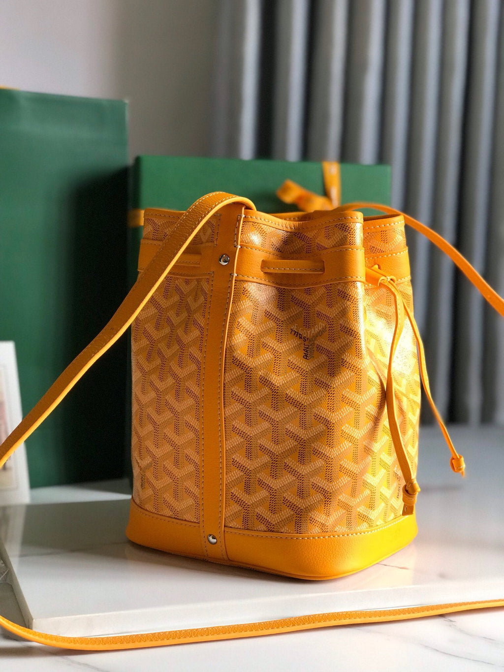 PETIT FLOT BUCKET BAG 22 IN YELLOW GOYARDINE CANVAS AND LAMBSKIN TRIM