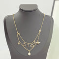 CD 26S MULTI CHARM LAYERED DIOR NECKLACE WITH PEARL DROP IN GOLD TONE 631779