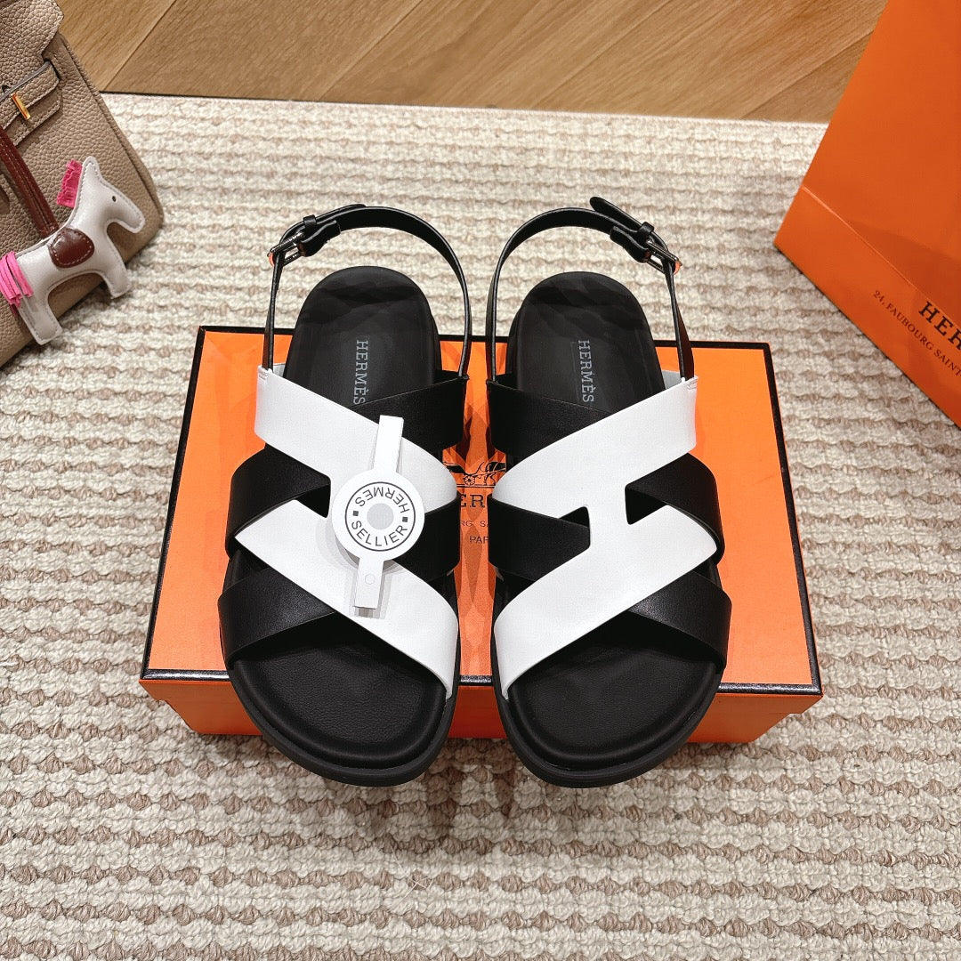 HM 26S CROSS-STRAP SANDALS IN BLACK AND WHITE CALFSKIN
