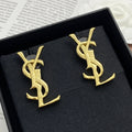 YSL 26S MONOGRAM DROP EARRINGS IN GOLD TONE METAL 629923