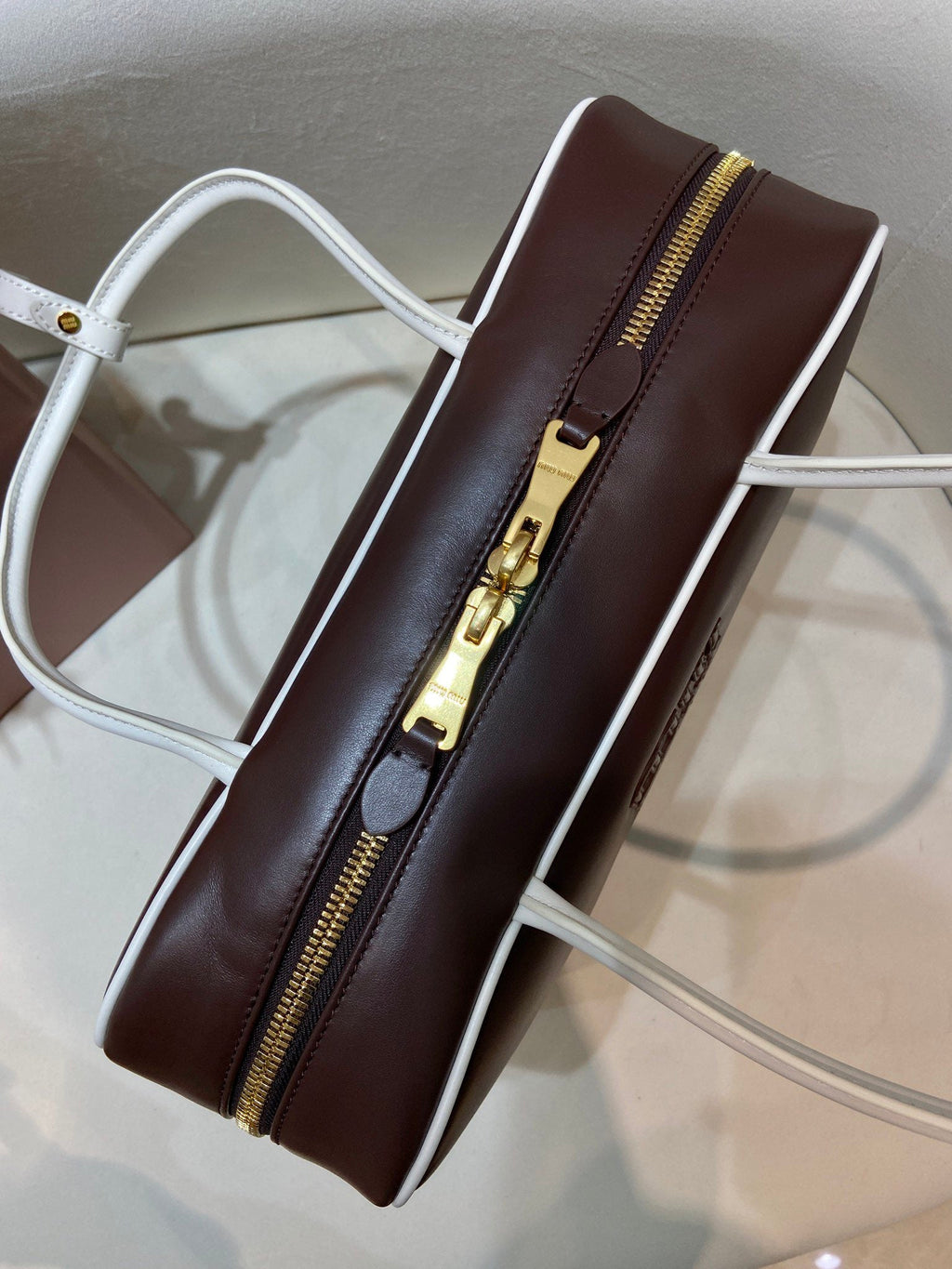 MIUMIU 26S BEAU BAG 34 IN DARK BROWN AND WHITE CALFSKIN