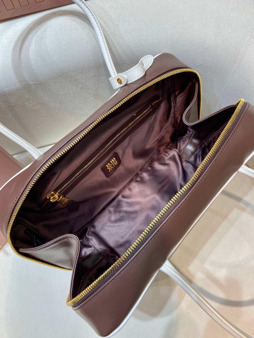 MIUMIU 26S BEAU BAG 34 IN DARK BROWN AND WHITE CALFSKIN