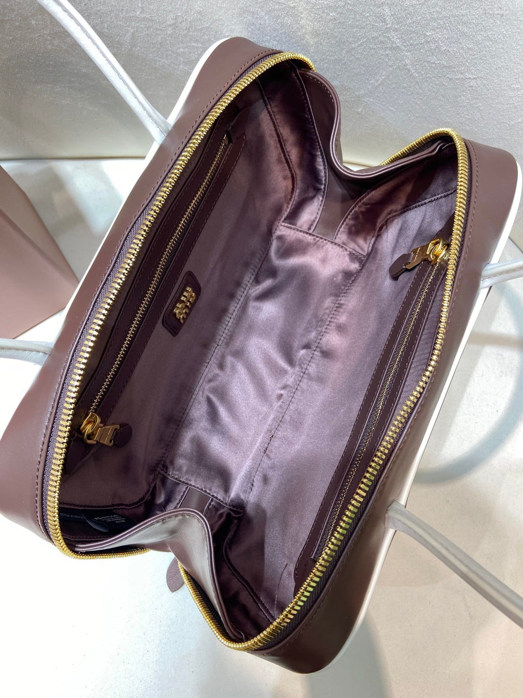 MIUMIU 26S BEAU BAG 30 IN DARK BROWN AND WHITE CALFSKIN