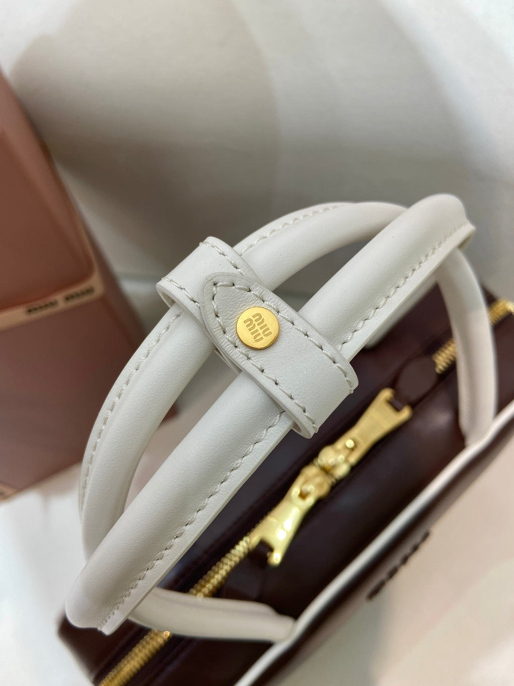 MIUMIU 26S BEAU BAG 30 IN DARK BROWN AND WHITE CALFSKIN