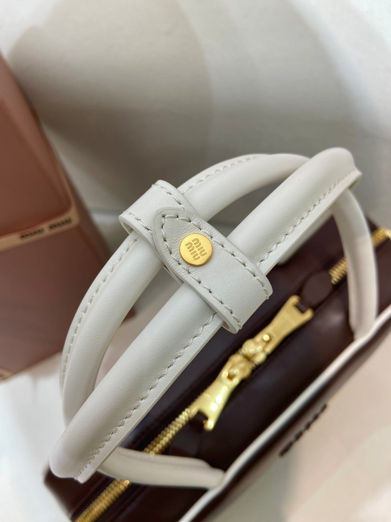 MIUMIU 26S BEAU BAG 30 IN DARK BROWN AND WHITE CALFSKIN